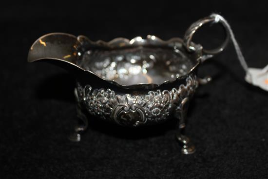 George II embossed silver cream jug